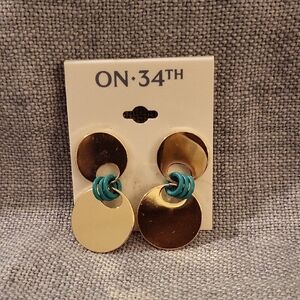 On 34th Gold Earrings With Green Accents